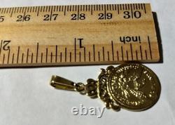 10K Solid Yellow Gold Coin Weight 2.39 Grams Length 1.4 Inches Long. 75inch Wide