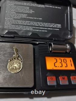 10K Solid Yellow Gold Coin Weight 2.39 Grams Length 1.4 Inches Long. 75inch Wide