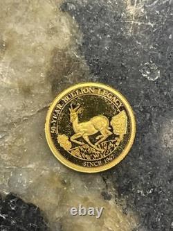 14k Gold coin. 05 grams. Gold South Africa 50 year Krugerrand