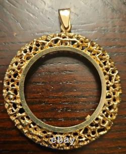 14k Yellow Gold 32.77mm Coin Opening Pendant. 13.15 grams of 14k gold