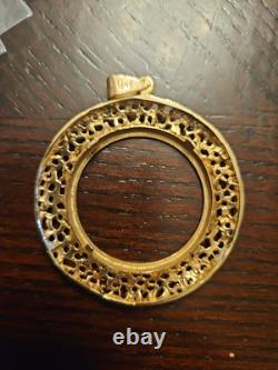 14k Yellow Gold 32.77mm Coin Opening Pendant. 13.15 grams of 14k gold