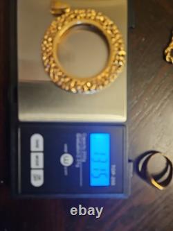14k Yellow Gold 32.77mm Coin Opening Pendant. 13.15 grams of 14k gold