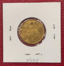 1889 Austria 20 Francs, 8 Florins Gold Coin, AU. 6.4516 Grams. 1867 Oz