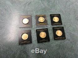 8 total -7 x 1 gram gold Maple leafs and 1 x 1 gram Sunshine mint gold coins/Bar