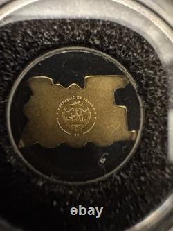 Palau Golden Train 0.5g Gold Coin (Shape of a Train) With Plastic Capsule