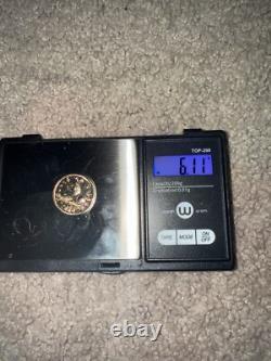 Real gold coins 6.11 grams doesn't stick to magnets 4 of them