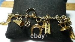 Vintage 14k Gold 7 Charm Bracelet With (25) Charms, 25.8 Grams Coin