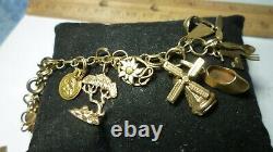 Vintage 14k Gold 7 Charm Bracelet With (25) Charms, 25.8 Grams Coin