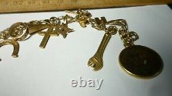 Vintage 14k Gold 7 Charm Bracelet With (25) Charms, 25.8 Grams Coin