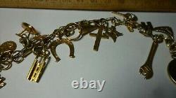 Vintage 14k Gold 7 Charm Bracelet With (25) Charms, 25.8 Grams Coin